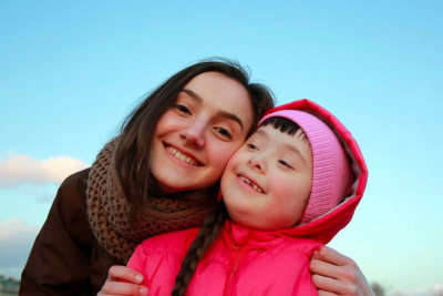 woman and little girl smiling