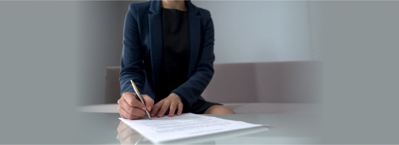 Woman signing documents to receive money